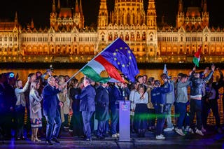 The European Union and revolutionary national flags fly after a speech by Peter Magyar